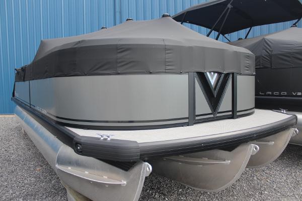 Viaggio X-22S 2024 Viaggio X-22S pontoon boat with cover, parked on gravel.