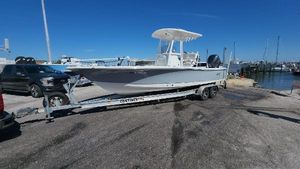 Sea Hunt BX 25 BR 2020 Sea Hunt BX 25 BR boat on trailer at marina, clear sky background.