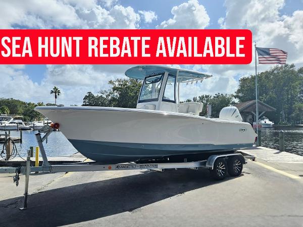Sea Hunt Ultra 239 SE 2025 Sea Hunt Ultra 239 SE boat on trailer, rebate available, dockside view.