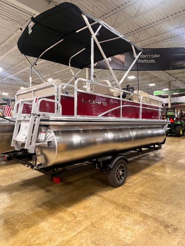 Lowe Ultra 180 Cruise 2025 Lowe Ultra 180 Cruise pontoon boat displayed indoors on a trailer.