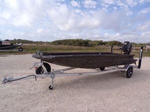 Xpress Bayou 180 2026 Xpress Bayou 180 boat on trailer, parked outdoors.