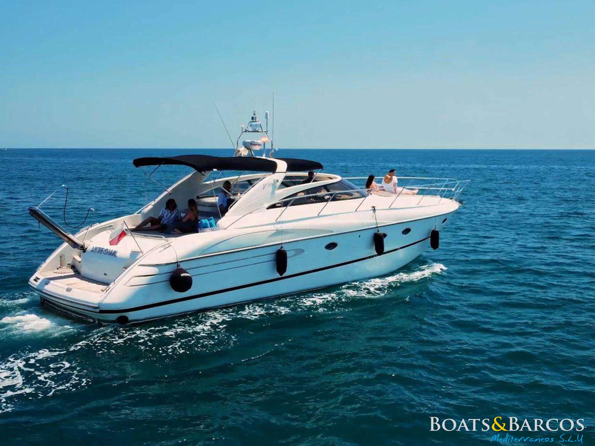 Princess V50 Luxury 2002 Princess V50 yacht cruising on open sea under clear blue sky.