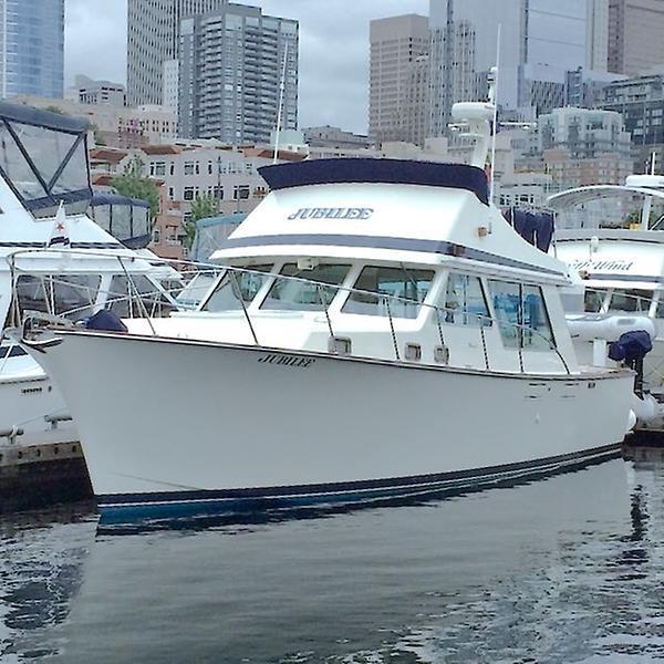 Tollycraft 37' diesel powered, Down Galley 1983 Tollycraft 37' diesel yacht docked in urban marina setting.