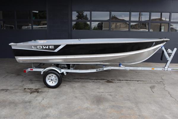 Lowe WV1470 2024 Lowe WV1470 boat on trailer, side view.