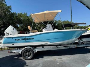 NauticStar 191 Hybrid 2024 NauticStar 191 Hybrid boat with blue hull on a trailer.