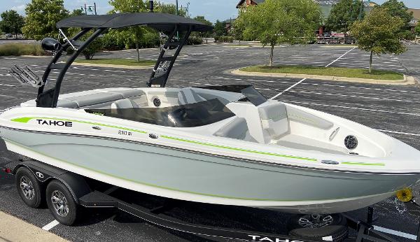 Tahoe 210 Si Limited 2023 Tahoe 210 Si Limited boat on trailer in parking lot.