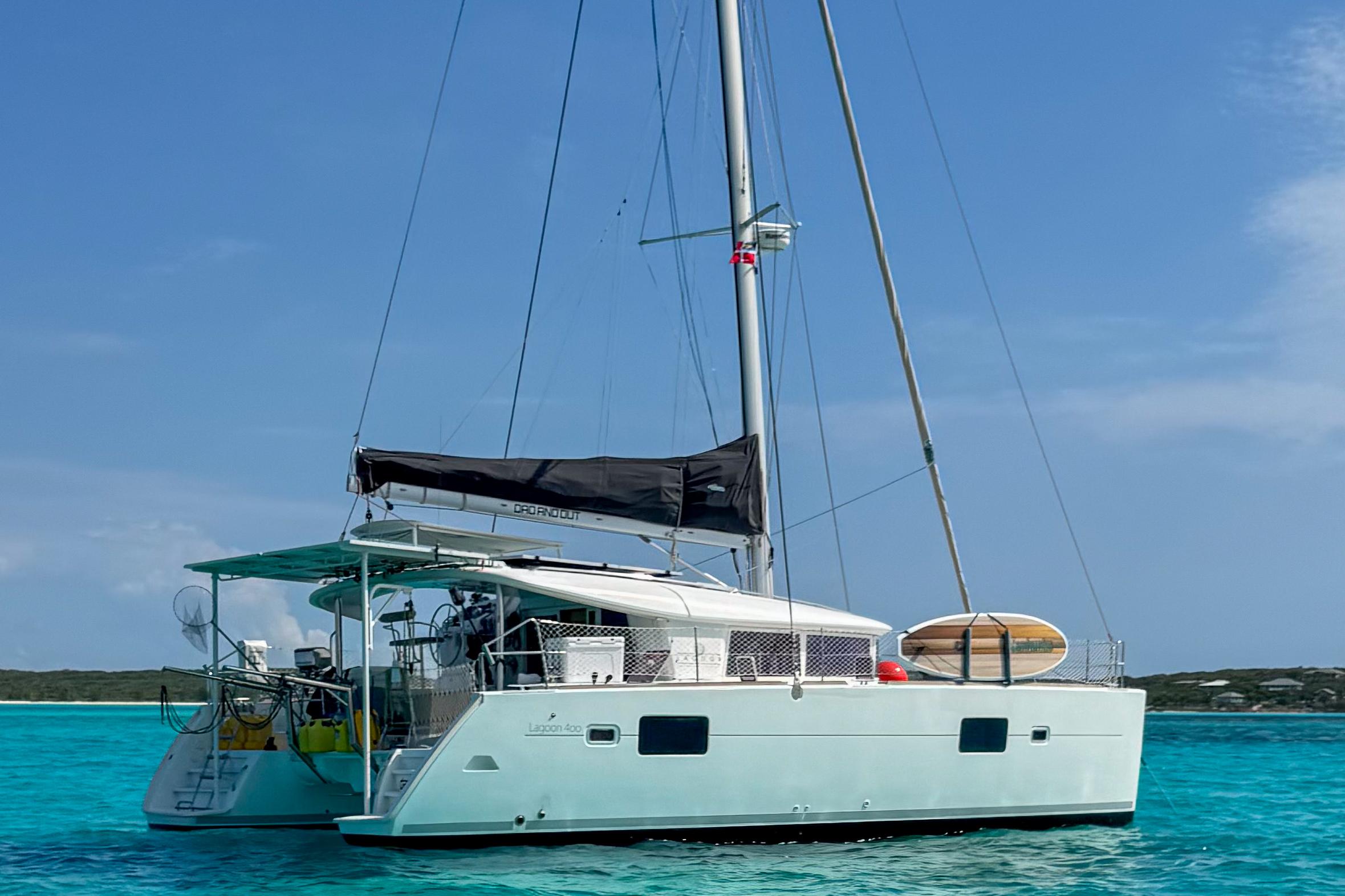 Lagoon 400 2011 Lagoon 400 catamaran sailing on clear turquoise waters under a blue sky.