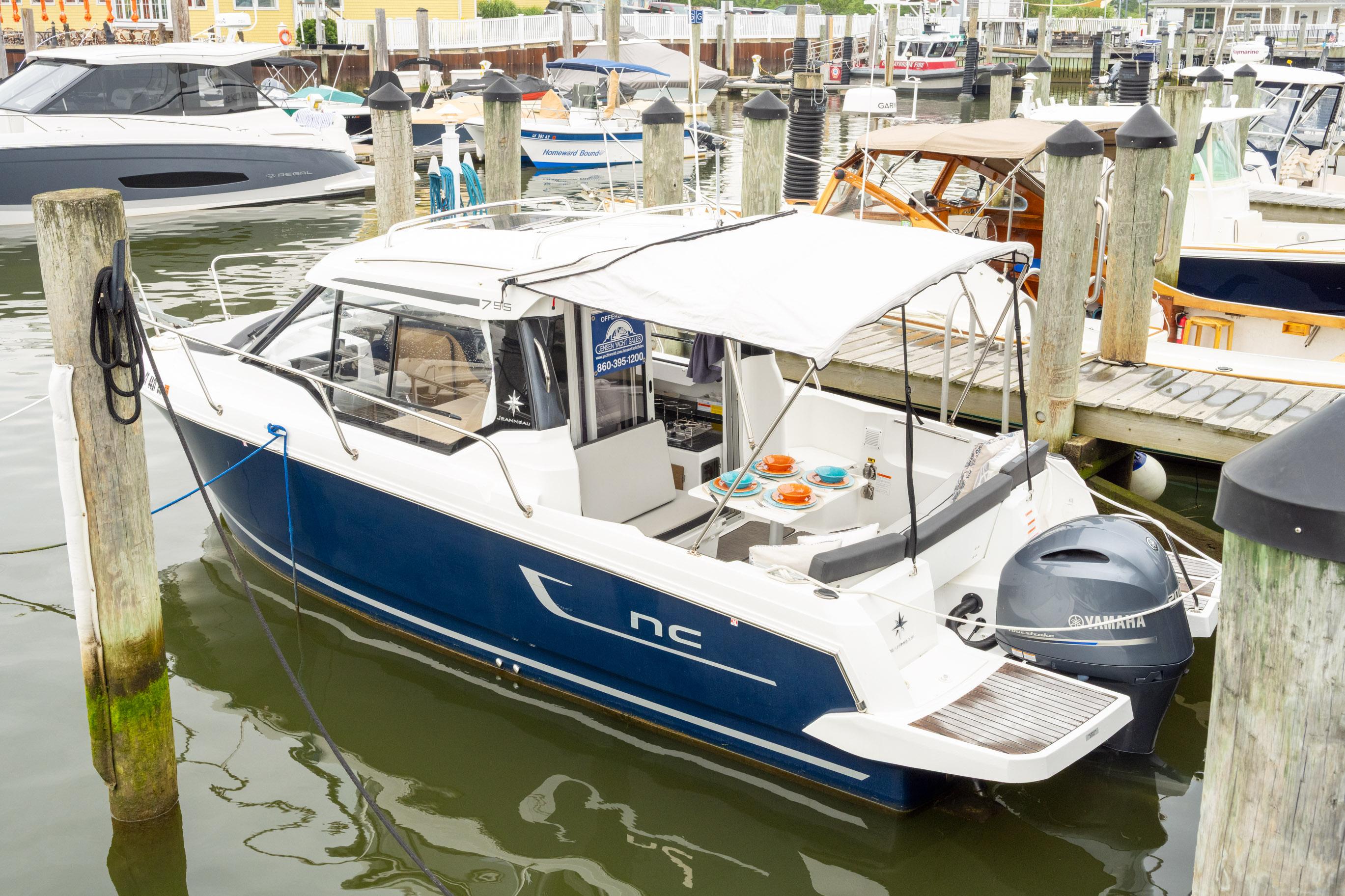 Jeanneau NC Weekender 795 Series 2 2021 Jeanneau NC Weekender 795 Series 2 docked, featuring Yamaha outboard motor.