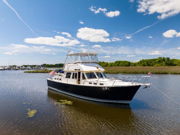 Sabreline Sabreline 47 Aft Cabin Trawler 1998 Sabreline 47 Aft Cabin Trawler on calm water under a clear blue sky.