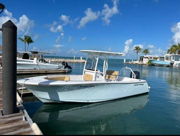 Sportsman Heritage 231 Center Console 2021 Sportsman Heritage 231 Center Console boat docked in a sunny marina.