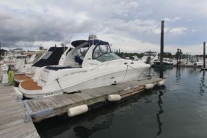 Sea Ray 340 Sundancer 2008 Sea Ray 340 Sundancer docked at marina under cloudy sky.