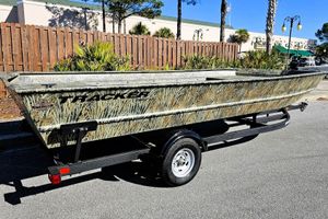 Tracker Grizzly 2072 Utility 2026 Tracker Grizzly 2072 Utility boat with camouflage design on a trailer.