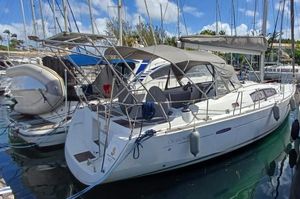 Beneteau Oceanis 40 2011 Beneteau Oceanis 40 sailboat docked in a marina under a clear blue sky.