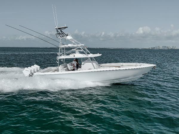 Contender 44 ST 2024 Contender 44 ST boat cruising on open water, showcasing sleek design and powerful engines.