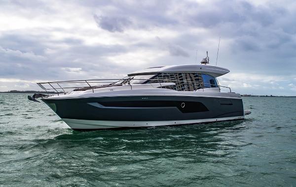 Prestige 520S 2024 Prestige 520S yacht cruising on open water under cloudy skies.