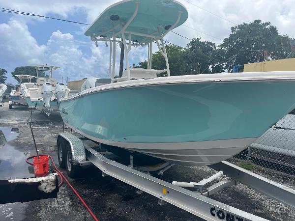 Sea Chaser 22 HFC 2025 Sea Chaser 22 HFC boat on a trailer in a marina.