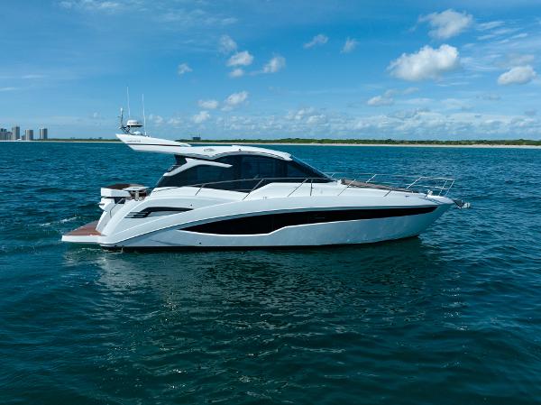Galeon 425 HTS 2022 Galeon 425 HTS yacht cruising on open water under a clear blue sky.