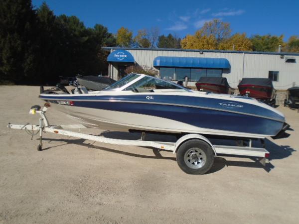 Tahoe Q5L I/O 1998 Tahoe Q5L I/O boat on trailer outside dealership.