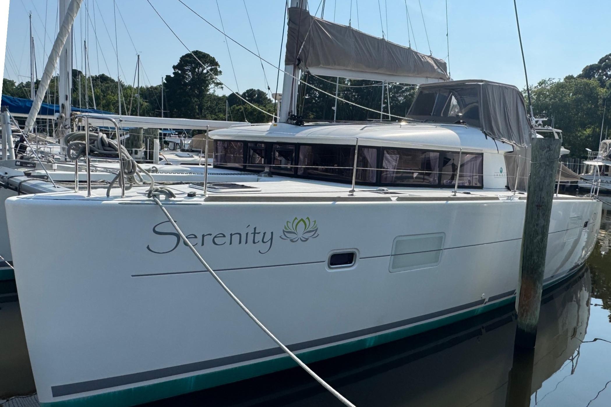 Lagoon 400 S2 2016 Lagoon 400 S2 catamaran named "Serenity" docked at a marina.