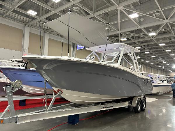 Sea Fox 288 Traveler Helm Master EX 2025 Sea Fox 288 Traveler boat displayed indoors on a trailer.