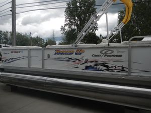 Crest Crest III 2010 Crest III pontoon boat with "Tooned Up" graphics and Crest Pontoons branding.