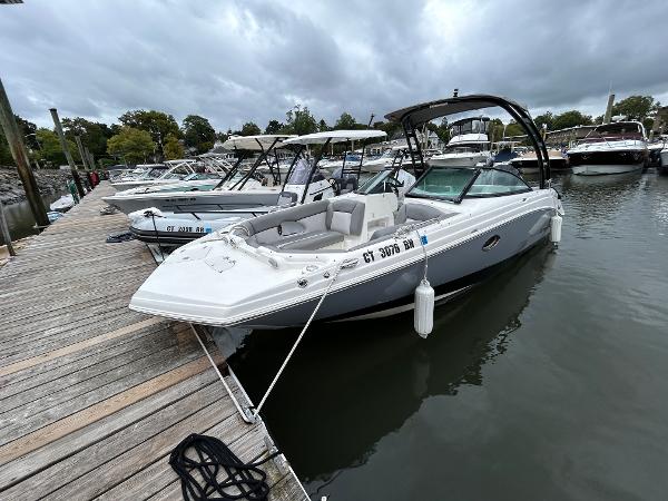 NauticStar 243 DC 2021 NauticStar 243 DC boat docked at marina under cloudy skies.