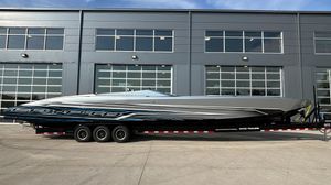 Outerlimits 50 SL Crypto II 2025 Outerlimits 50 SL Crypto II speedboat on trailer, parked outside industrial building.