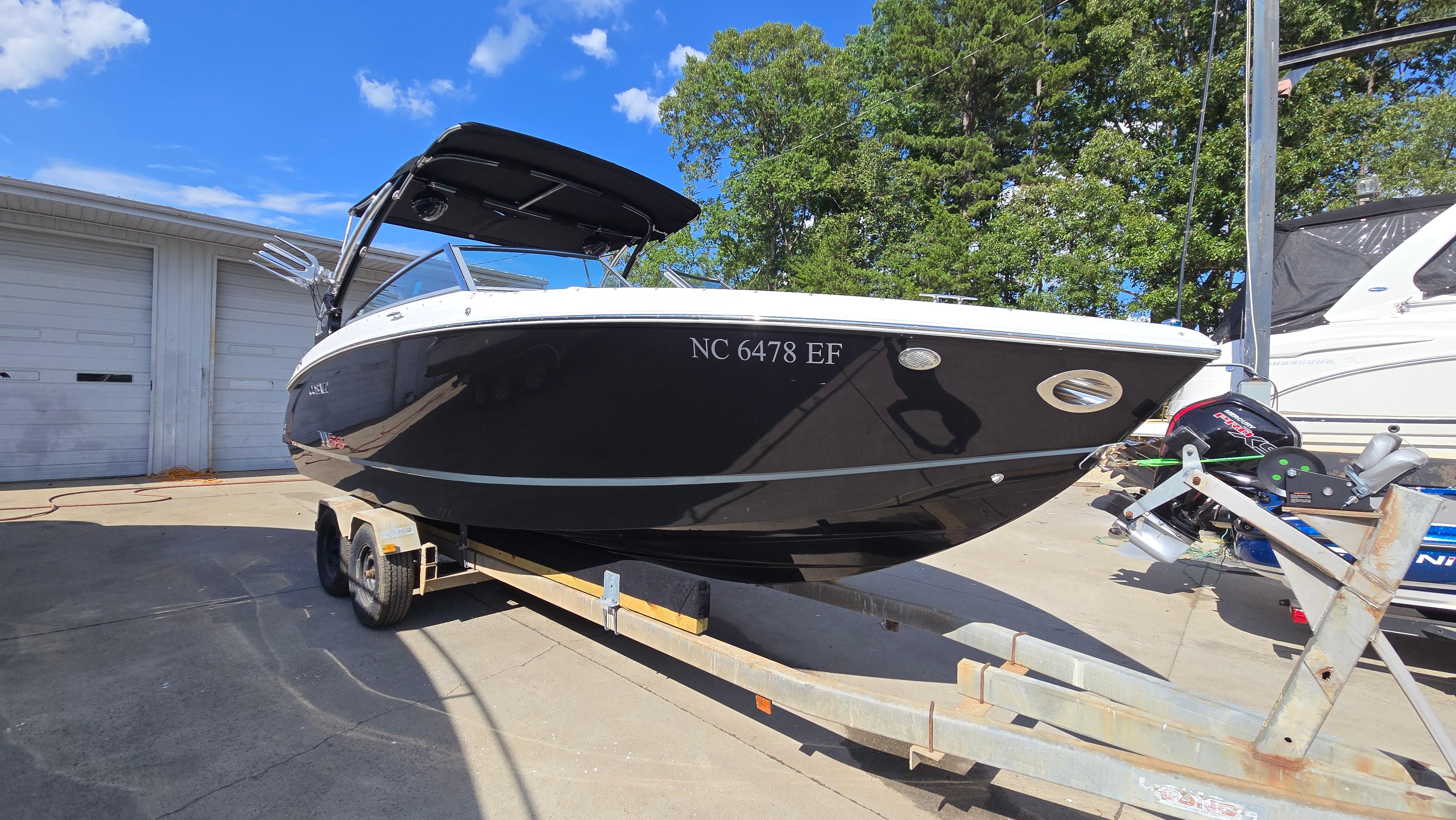 Cobalt R5 WSS Surf 2017 Cobalt R5 WSS Surf boat on trailer, parked outdoors under blue sky.