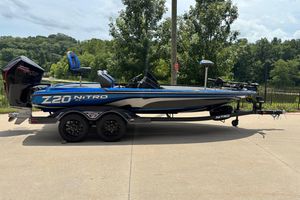 Nitro Z20 XL Pro 2026 Nitro Z20 XL Pro boat on trailer, parked outdoors with trees in background.