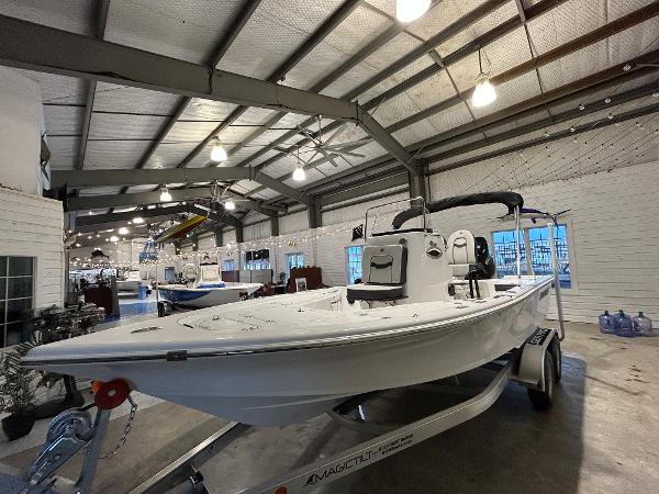 Sea Pro 210 Bay 2025 Sea Pro 210 Bay boat displayed indoors on a trailer.