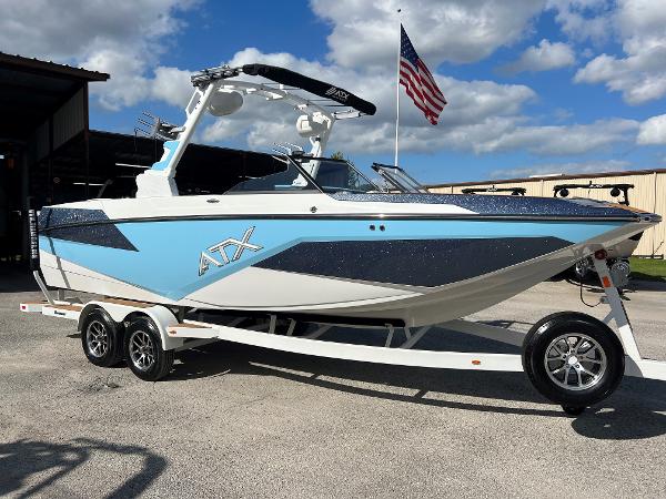 ATX Surf Boats 24 Type-S 2024 ATX Surf Boats 24 Type-S in blue and white on a trailer.