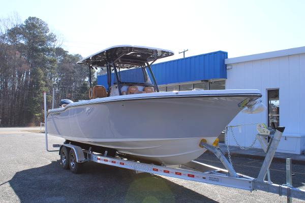 Key West 263 FS 2025 Key West 263 FS boat on trailer, parked outside a building.