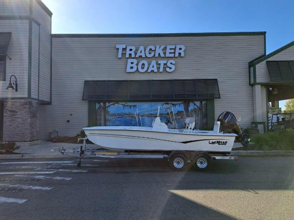 Mako Pro Skiff 19 CC 2023 Mako Pro Skiff 19 CC boat on trailer outside Tracker Boats store.