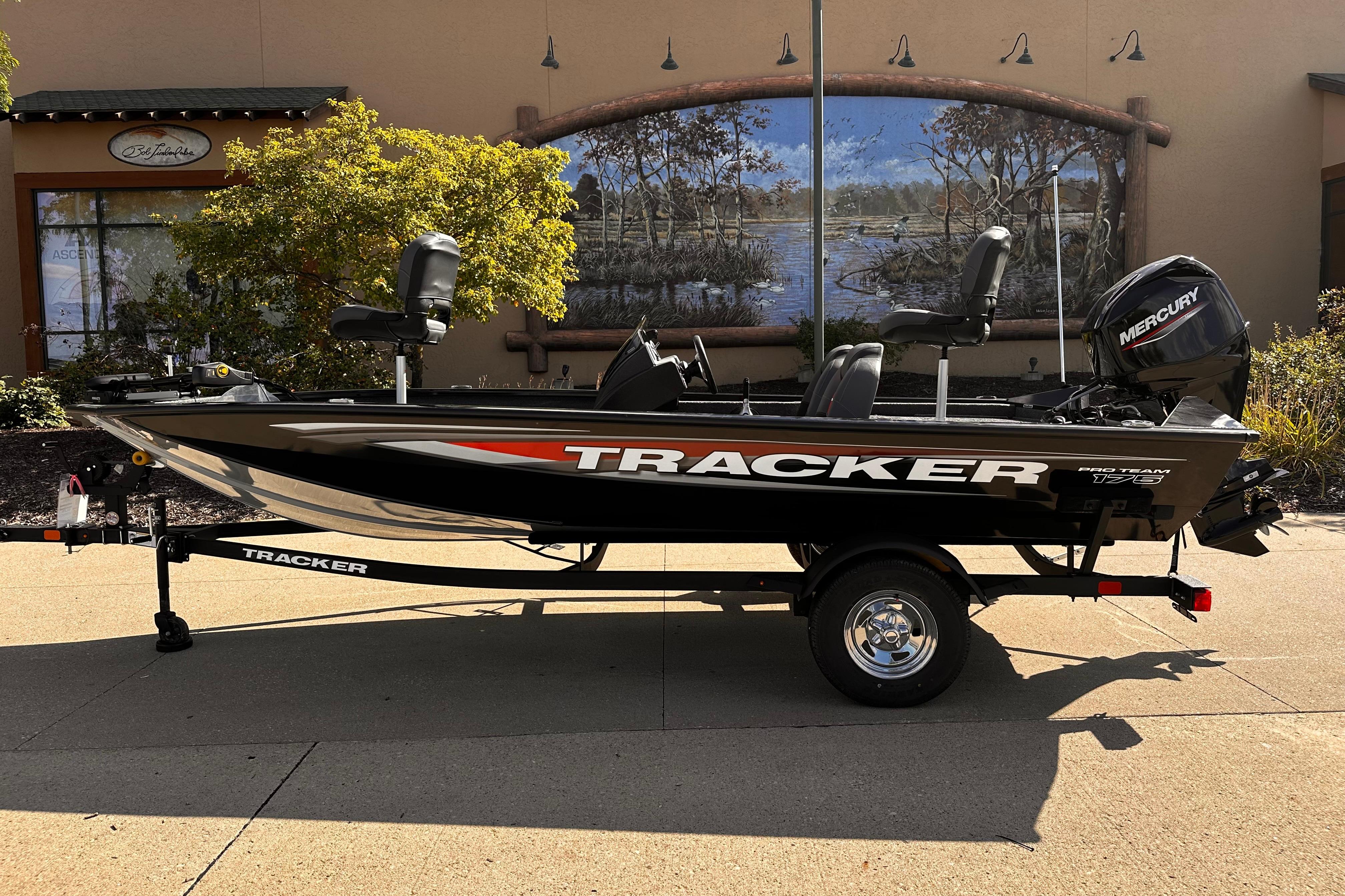 Tracker Pro Team 175 2026 Tracker Pro Team 175 boat on trailer, outdoor setting, side view.