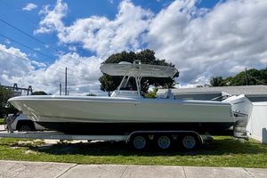 Intrepid 327 Center Console 2008 Intrepid 327 Center Console boat on trailer under blue sky.