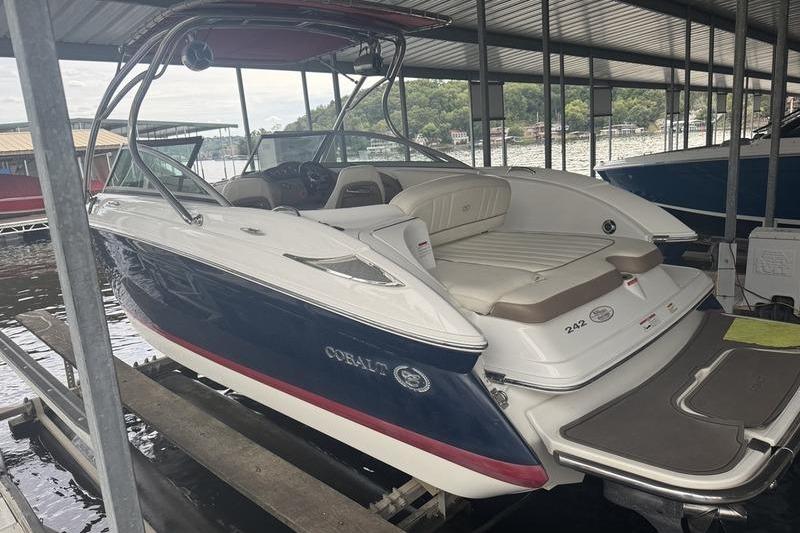 Cobalt 242 WSS 2012 Cobalt 242 WSS boat docked in covered marina, rear view.