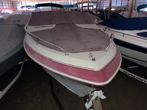Cobalt 23 1988 Cobalt 23 boat with cover in storage facility.