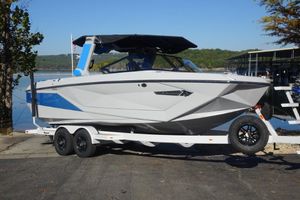 Nautique Super Air Nautique G23 2024 Nautique Super Air Nautique G23 boat on trailer by lakeside.