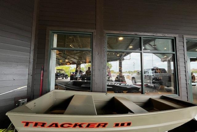 Tracker Grizzly 10 Jon 2026 Tracker Grizzly 10 Jon boat displayed indoors near large windows.