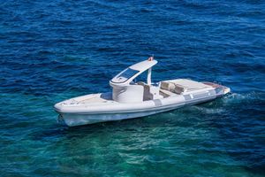 Pirelli 1100 Sport 2012 Pirelli 1100 Sport boat cruising on clear blue ocean waters.
