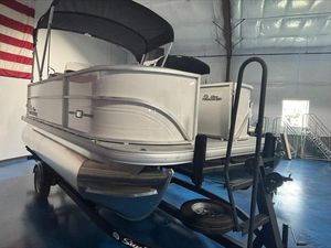Sun Tracker PB 16 DLX 2026 Sun Tracker PB 16 DLX pontoon boat on trailer in indoor storage.