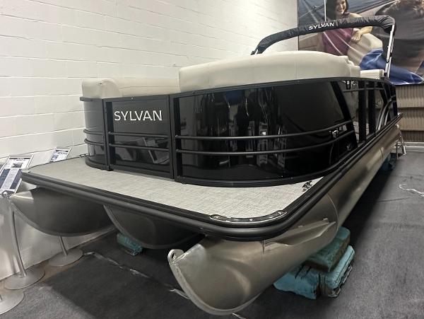 Sylvan Mirage X3 CLZ DH 2025 Sylvan Mirage X3 CLZ DH pontoon boat displayed indoors.