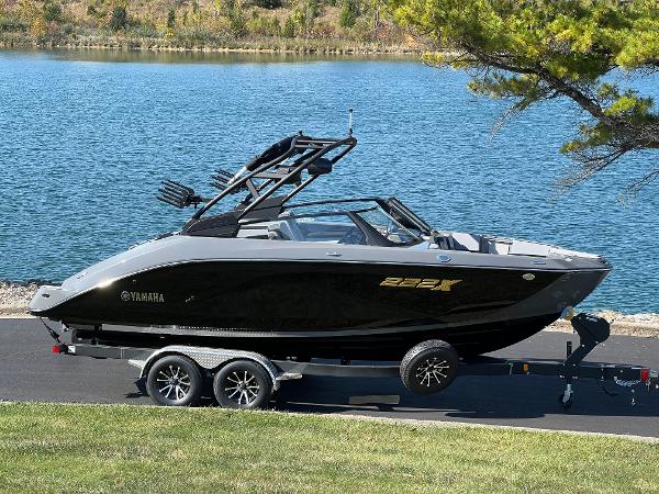 Yamaha Boats 222XD 2025 Yamaha Boats 222XD on trailer by a scenic lake.