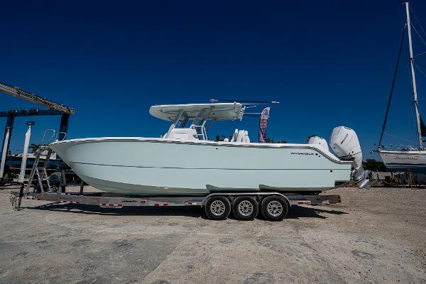Invincible 33 Catamaran 2025 Invincible 33 Catamaran on trailer, side view, clear blue sky background.