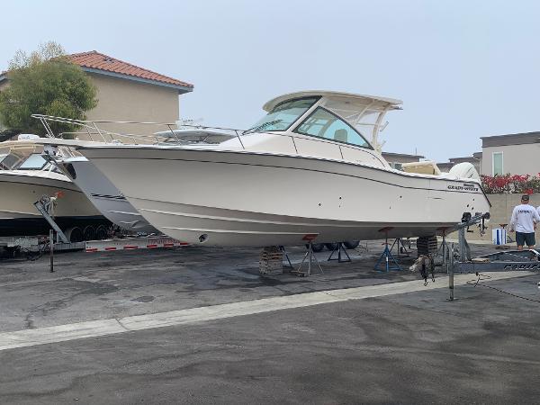 Grady-White 330 Express 2025 Grady-White 330 Express boat on display in a marina setting.