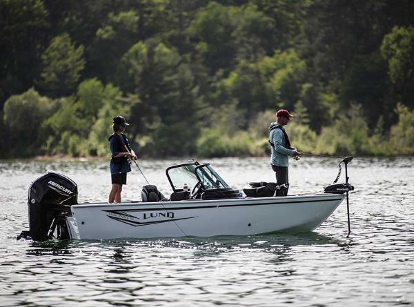 Lund 1650 Rebel XL SS 2026 Lund 1650 Rebel XL SS boat with two people fishing on a lake.