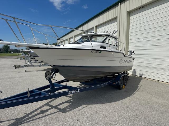 Bayliner Trohpy 1995 Bayliner Trophy boat on trailer outside storage facility.