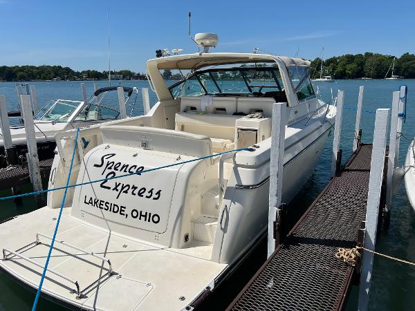 Tiara Yachts Express 1995 Tiara Yachts Express docked at Lakeside, Ohio, with clear blue skies.