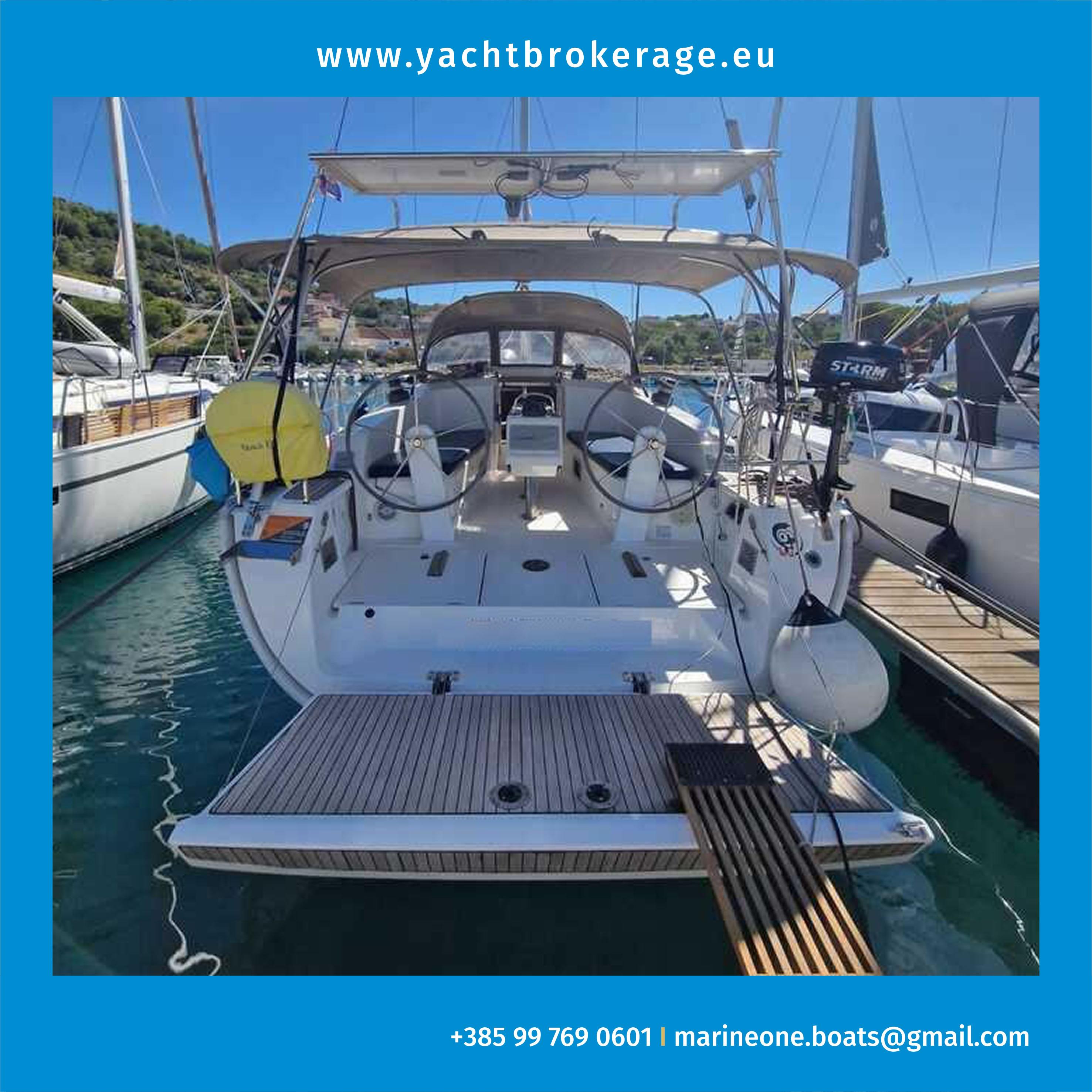 Bavaria Cruiser 41 2015 Bavaria Cruiser 41 yacht docked at marina, rear view with dual steering wheels.