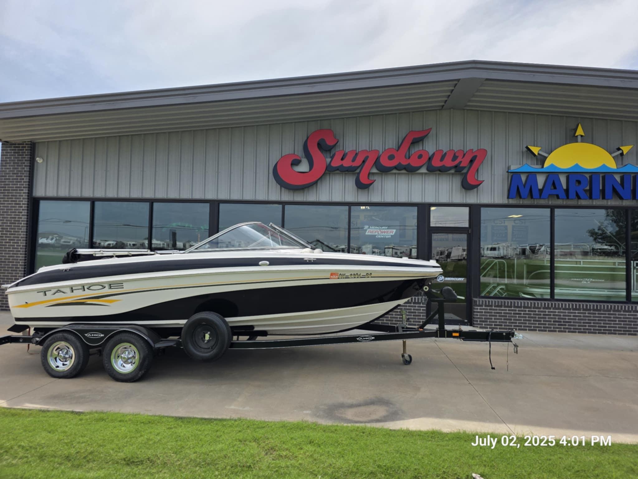 Tahoe Q6 SF 2006 Tahoe Q6 SF boat on trailer outside Sundown Marine dealership.